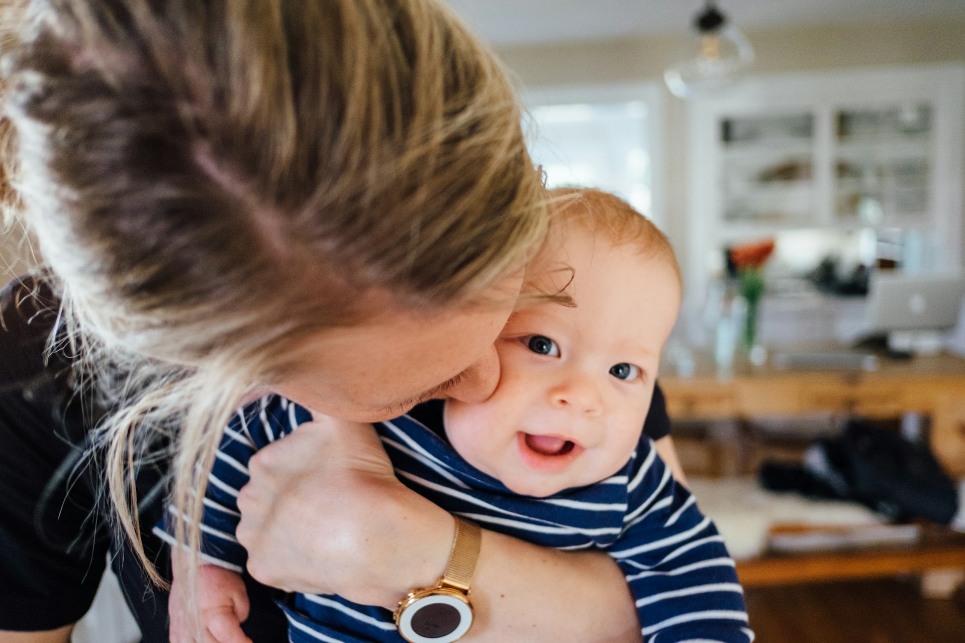 Woman carrying a baby